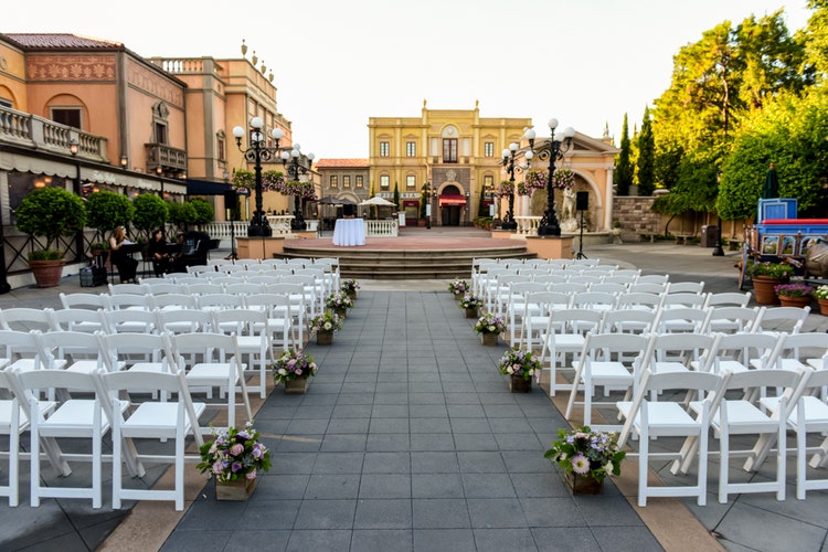 Chairs lined up along an aisle leading to a terrace at the center of the Italy Pavilion in EPCOT