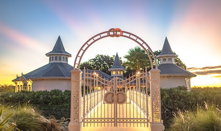 An elegant gate manages entry to the bridge at Disney’s Wedding Pavilion