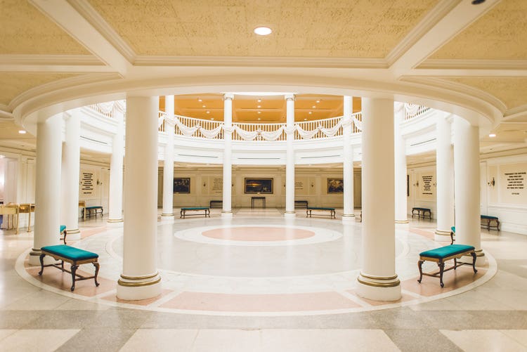 A spacious rotunda with large pillars at The American Adventure in EPCOT