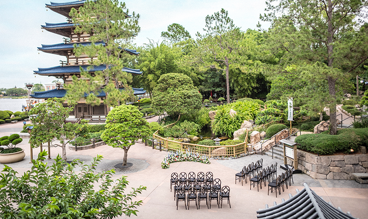 30 chairs arranged in 3 rows for an outdoor wedding beside a pagoda in the Japan Pavilion at EPCOT