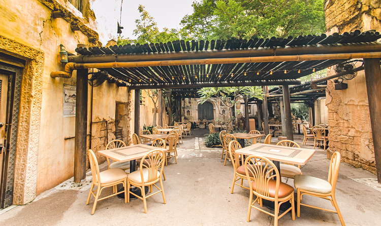 A reception space set up under a covered courtyard at Harambe Market in Disney’s Animal Kingdom theme park.