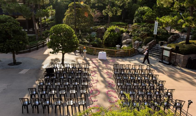 30 chairs arranged in 3 rows for an outdoor wedding in the Japan Pavilion at EPCOT