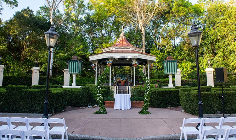 A gazebo and aisle of chairs are set up in the United Kingdom Pavilion at EPCOT