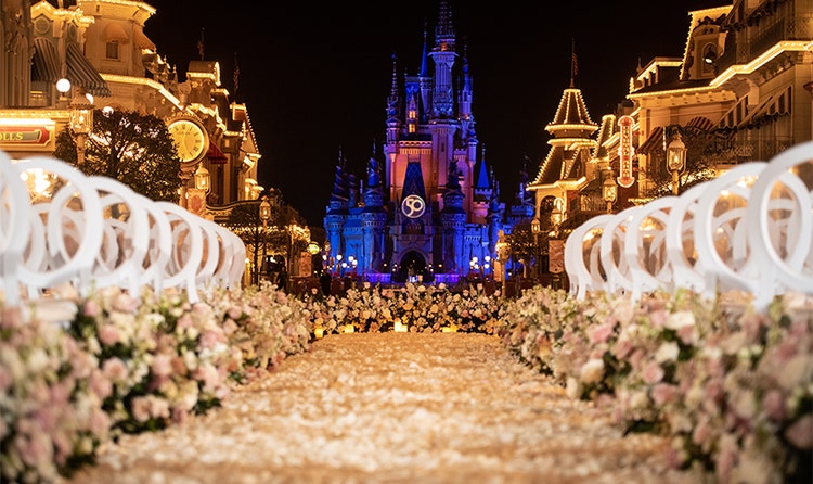 A walkway of flowers leads down Main Street, U S A toward Cinderella Castle at Magic Kingdom park