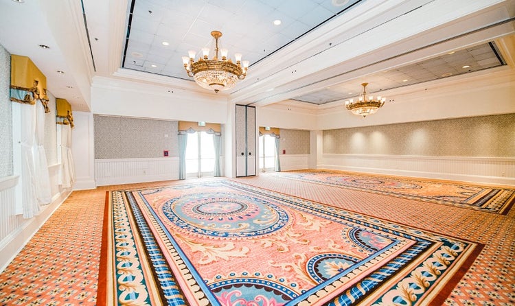 An intimate ballroom at Disney's BoardWalk Inn featuring chandeliers