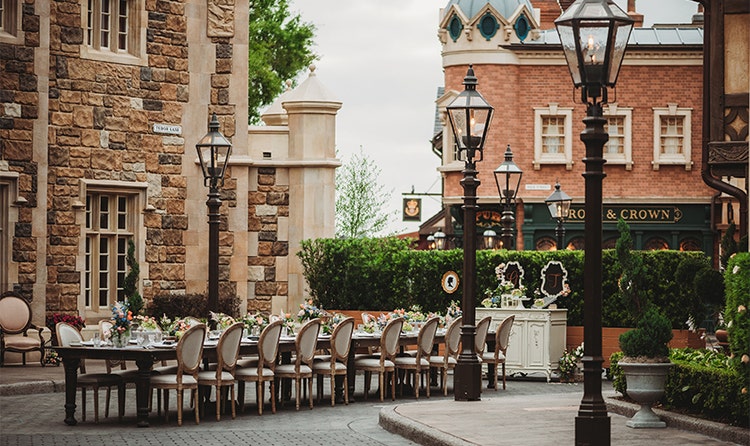 A long table and chairs in the United Kingdom Pavilion at EPCOT