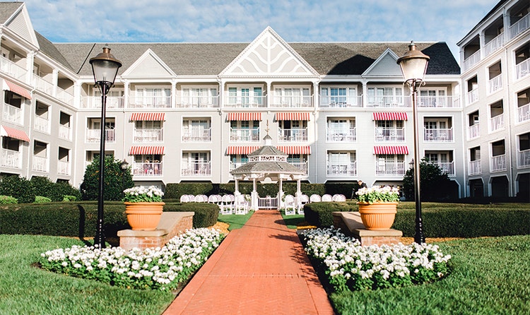 A long pathway leads to a gazebo at Disney's Yacht Club Resort