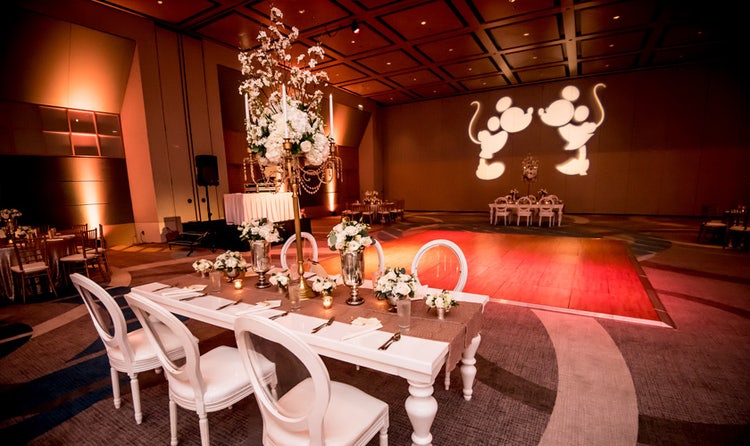 Tables with elaborate centerpieces in a ballroom
