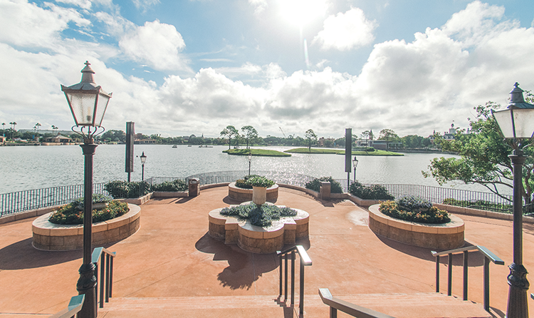 Terrace des Fleurs, a large terrace with several flower beds overlooking Crescent Lake at EPCOT