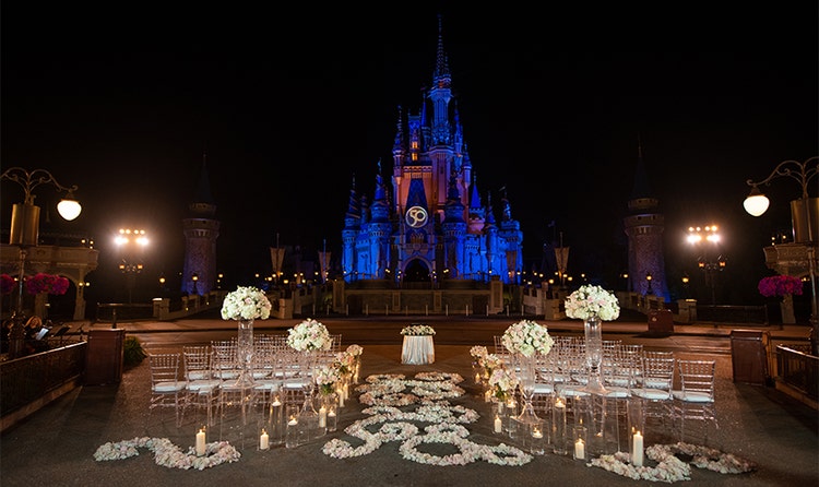 Aisles of chairs are set up in front of Cinderella Castle in Magic Kingdom park