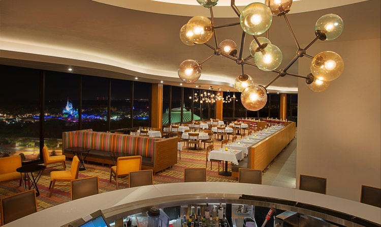 The dining room and lounge at California Grill in Disney’s Contemporary Resort with views of Magic Kingdom park
