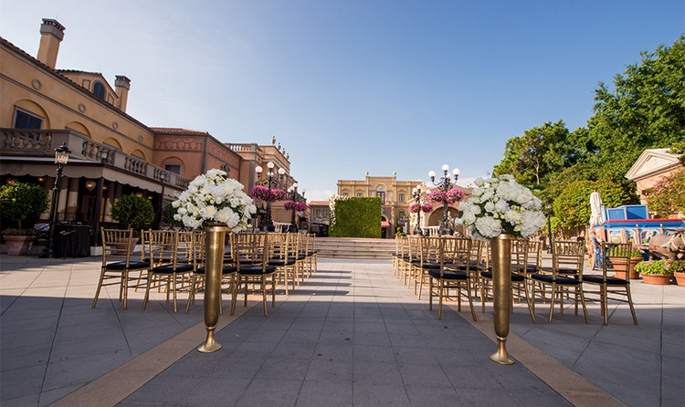 Chairs lined up along an aisle leading to a terrace at the center of the Italy Pavilion in EPCOT