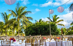 Lanterns hang from wires over a wedding reception