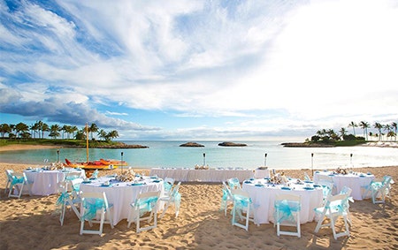 Rows of chairs set up on Aulani Beach facing the ocean at Aulani, A Disney Resort and Spa
