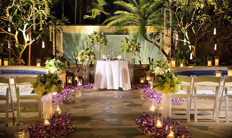An aisle on a courtyard leading to an altar