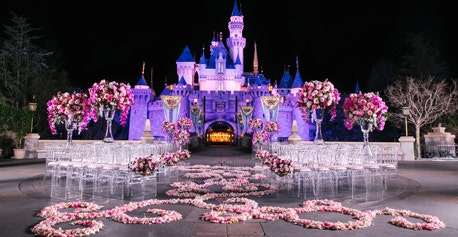 A flower lined aisle in front of Sleeping Beauty Castle in Disneyland Park