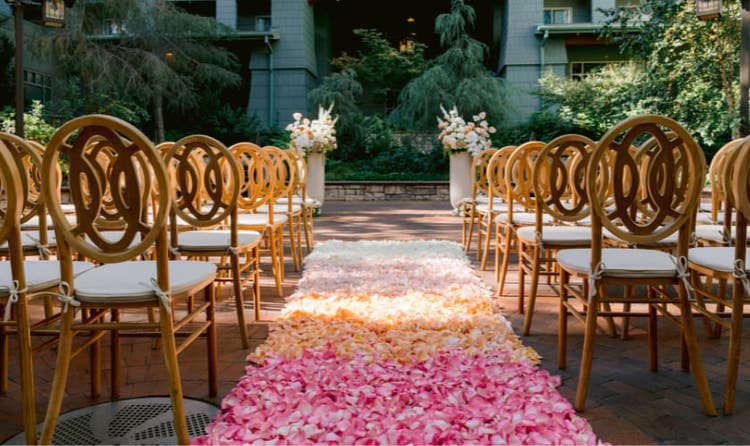 A wedding ceremony aisle covered in rose petals at Disney's Grand Californian Hotel and Spa
