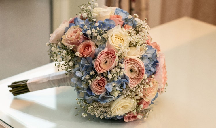 A bridal bouquet with roses and hydrangeas