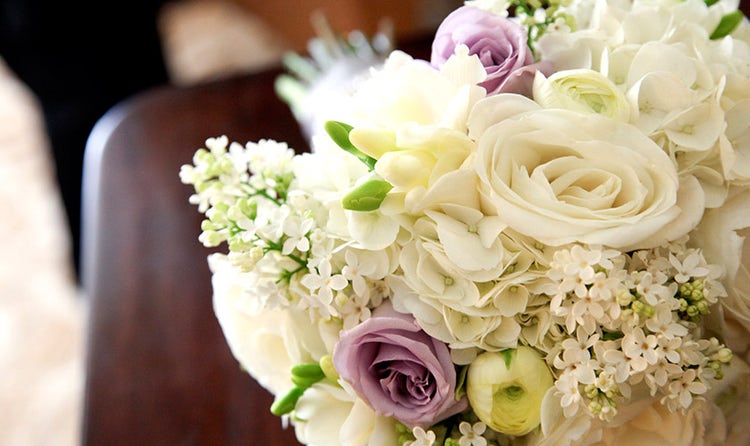 White rose and purple rose with white accents bridal bouquet
